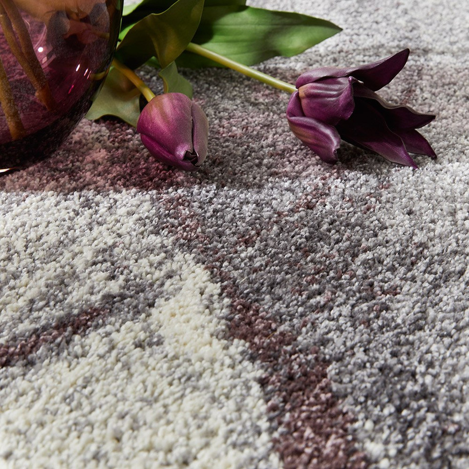 plum geometric rug closeup with flower
