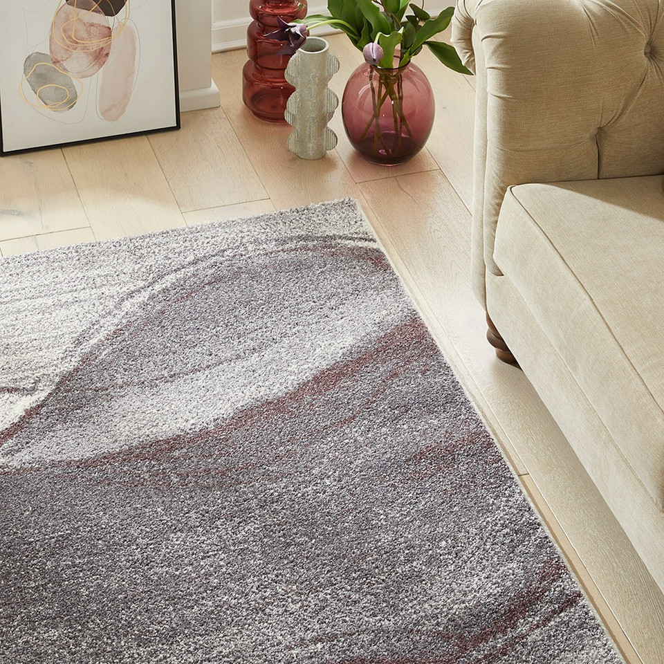 plum geometric rug in a living room with matching decor