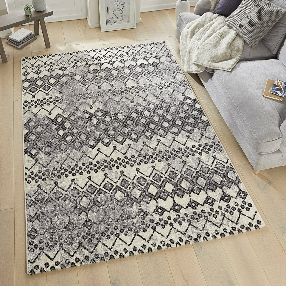 anthracite geometric rug in a living room with matching decor