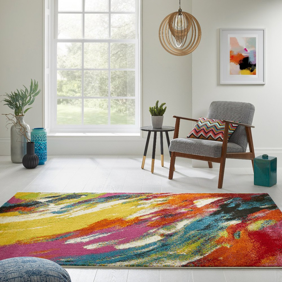 multicolour abstract rug in a living room with matching decor