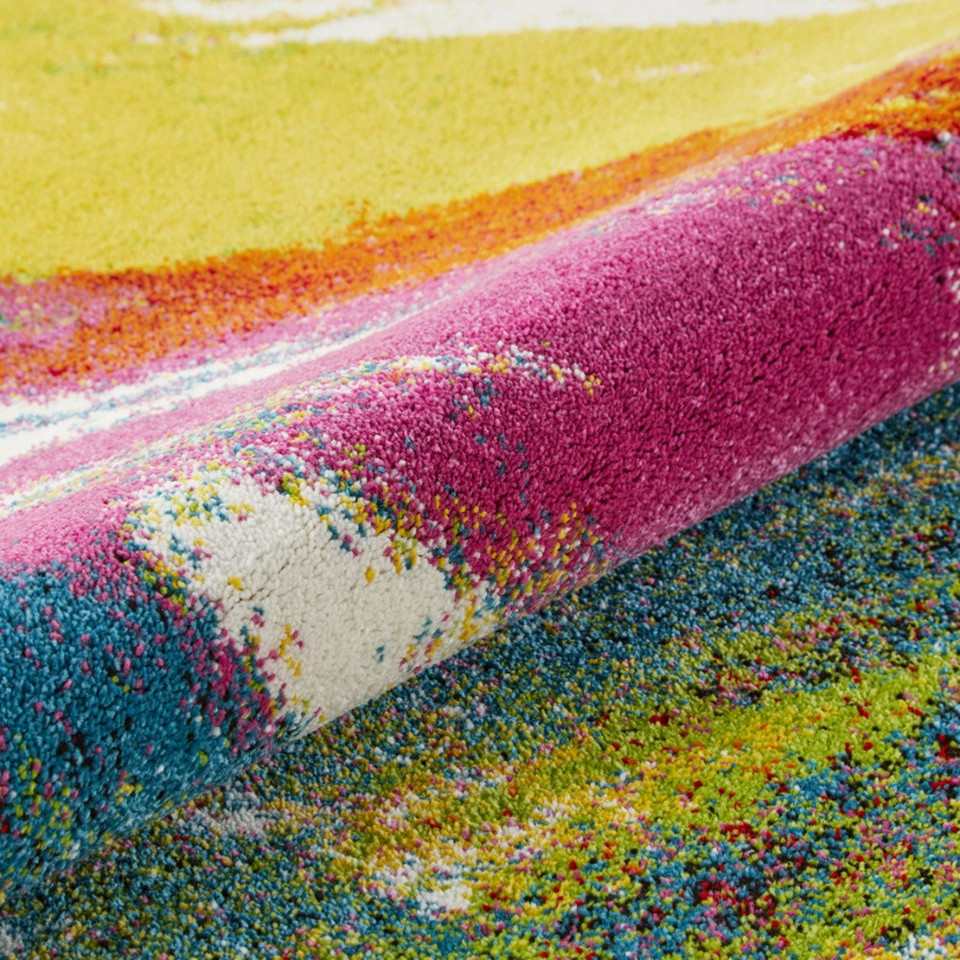 multicolour abstract rug closeup partially rolled