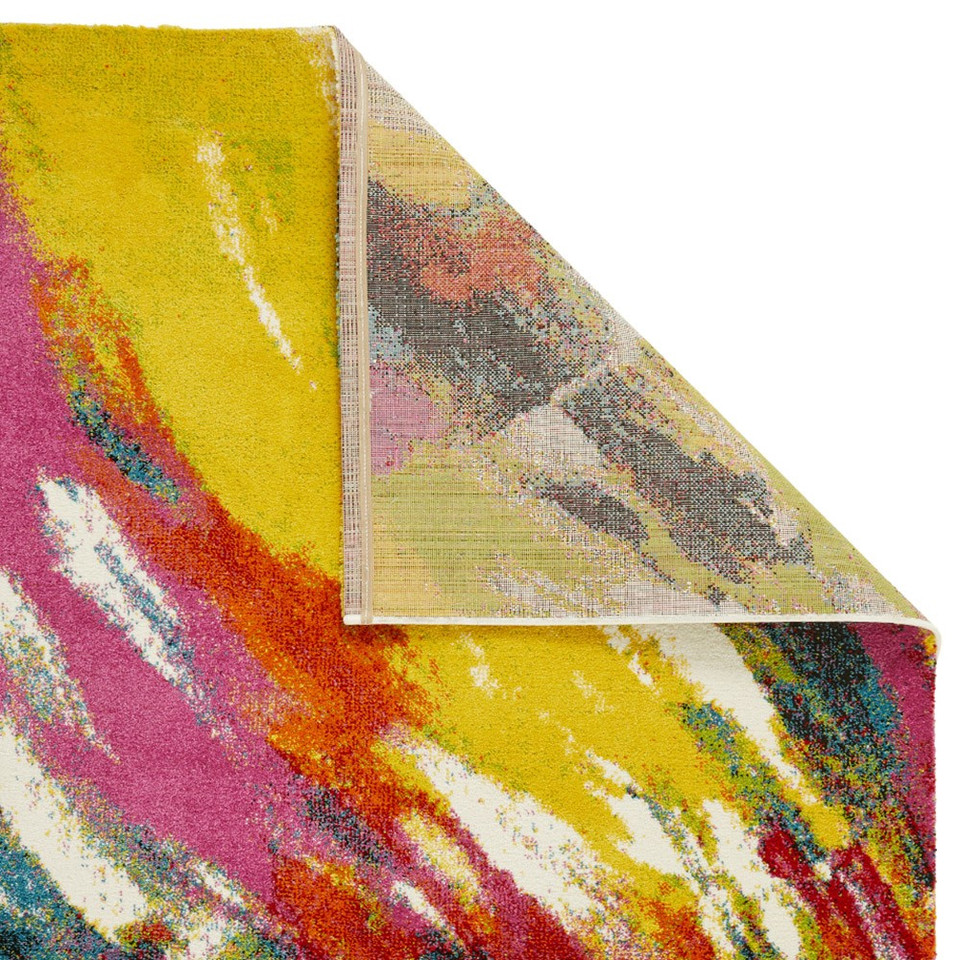 multicolour abstract rug closeup corner folded on white background