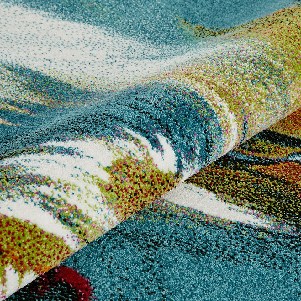 multicolour abstract rug closeup partially rolled