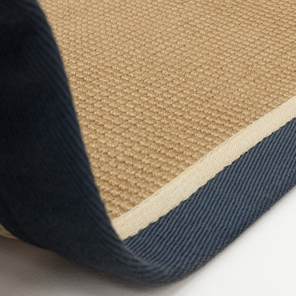 blue cream jute rug closeup on white floor