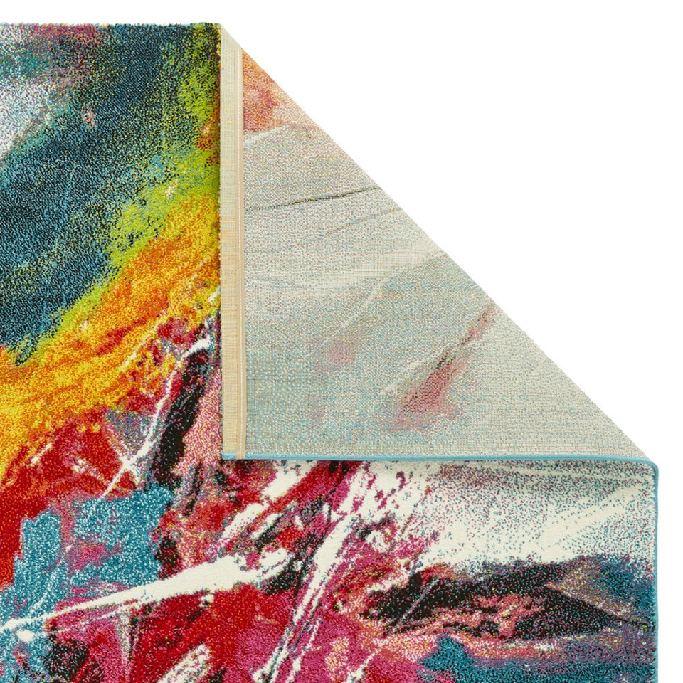 multicolour abstract rug closeup corner folded on white background