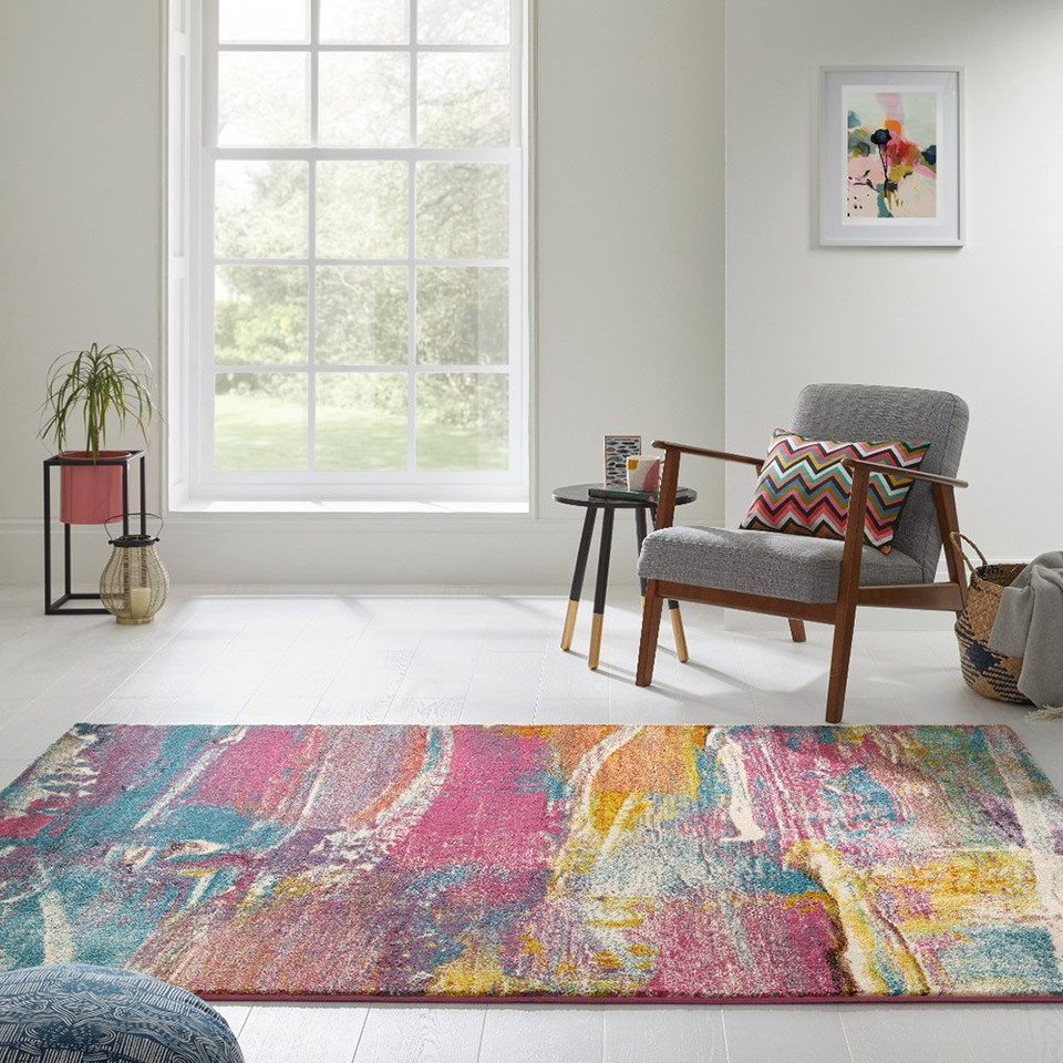 multicolour abstract rug in a living room with matching decor
