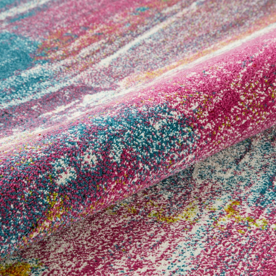 multicolour abstract rug closeup partially rolled