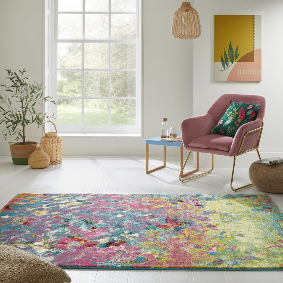 multicolour abstract rug in a living room with matching decor