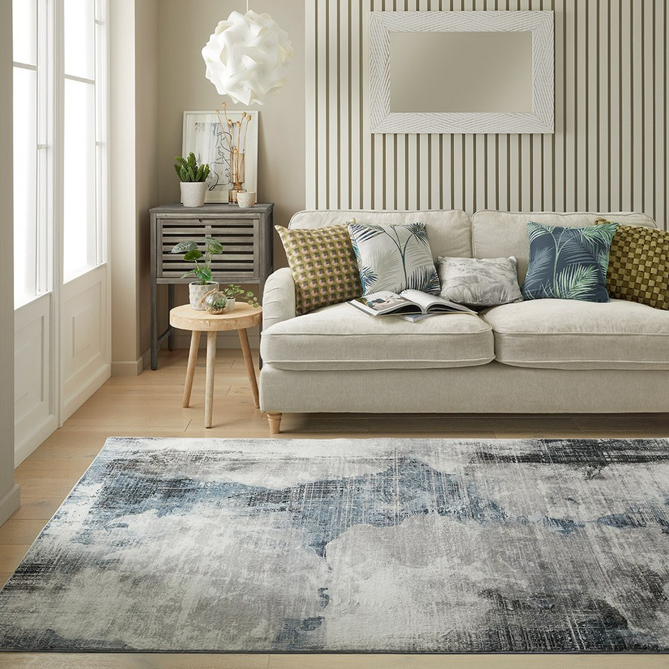 grey abstract rug in a living room with matching decor