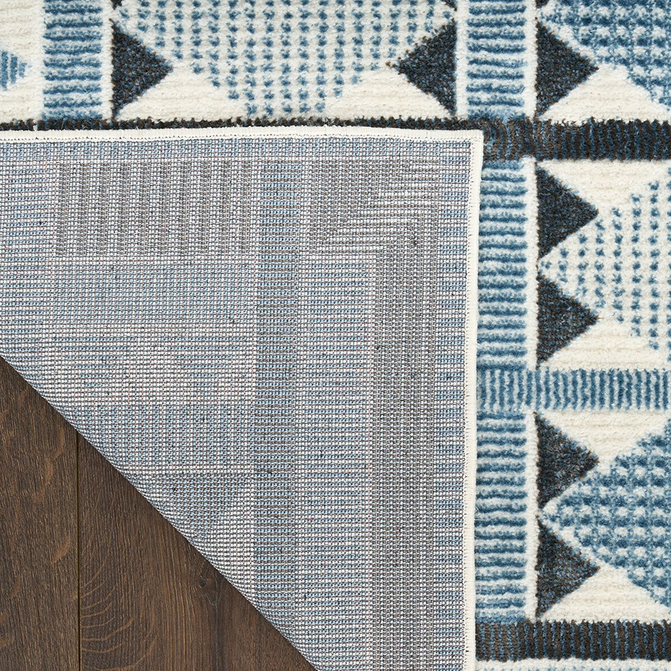blue geometric rug corner fold