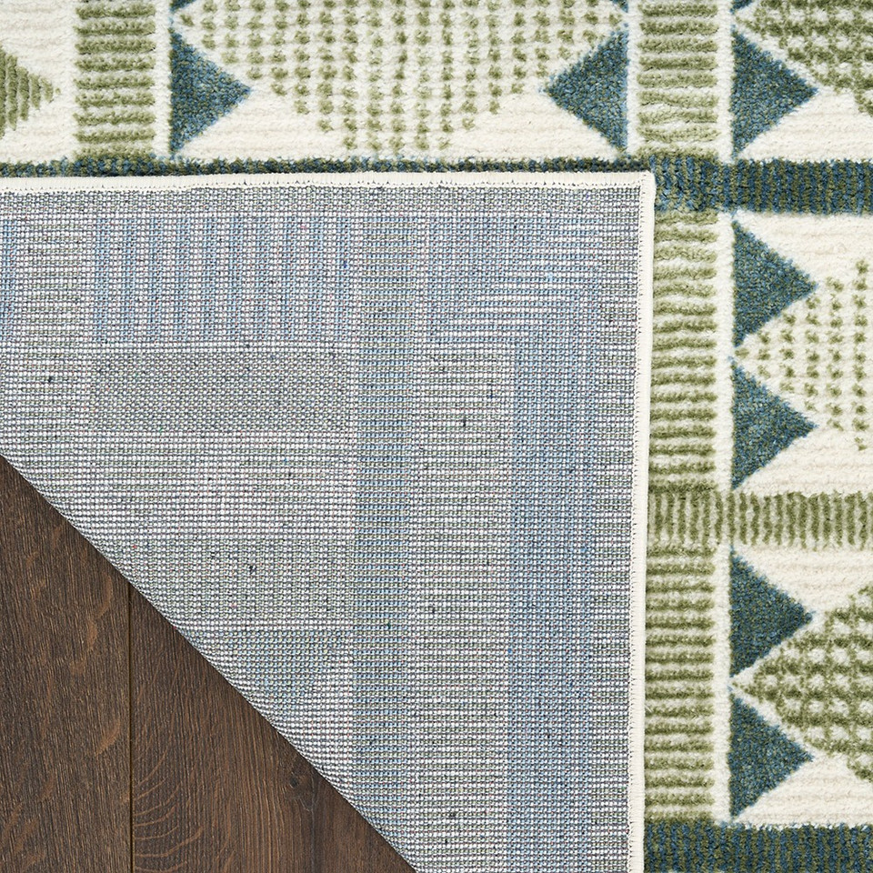 green blue geometric rug corner fold