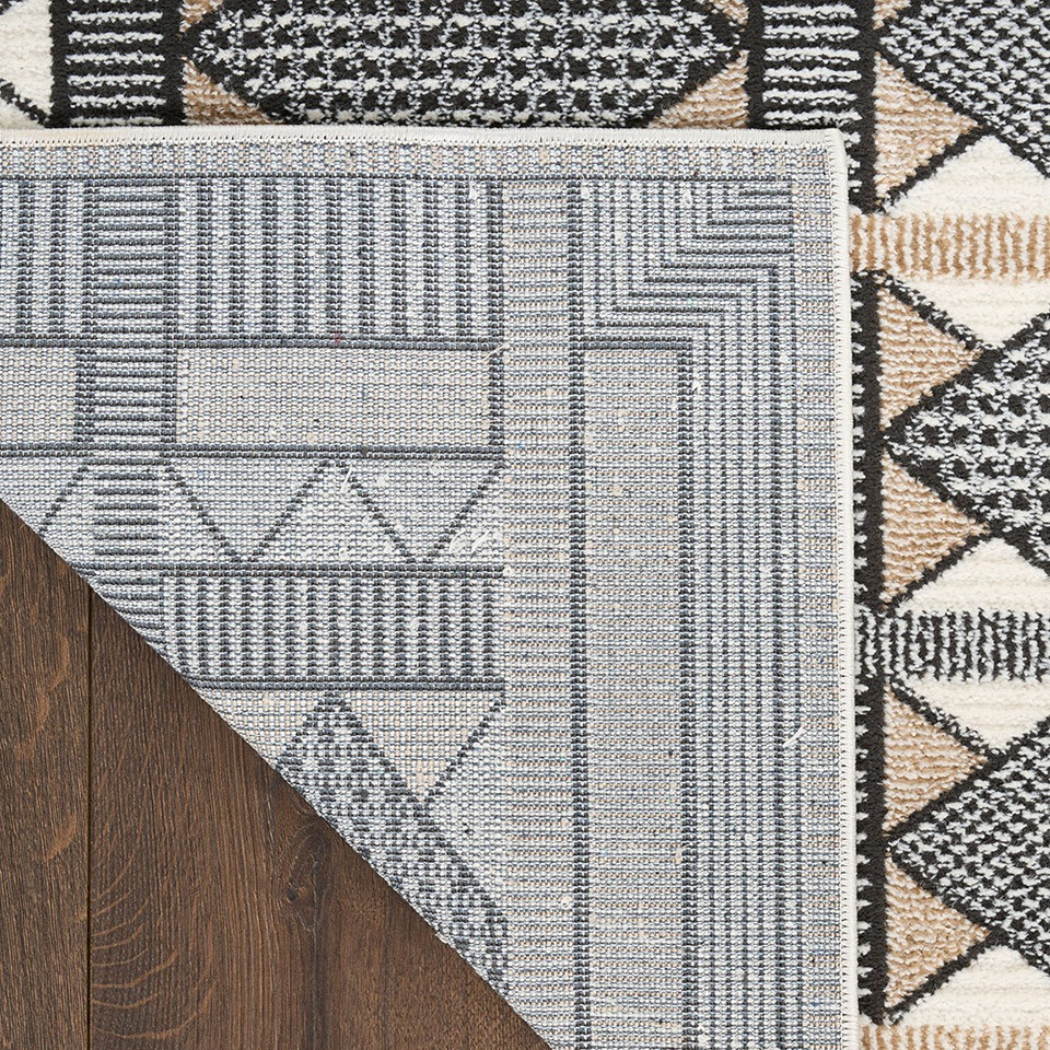 beige black geometric rug corner fold
