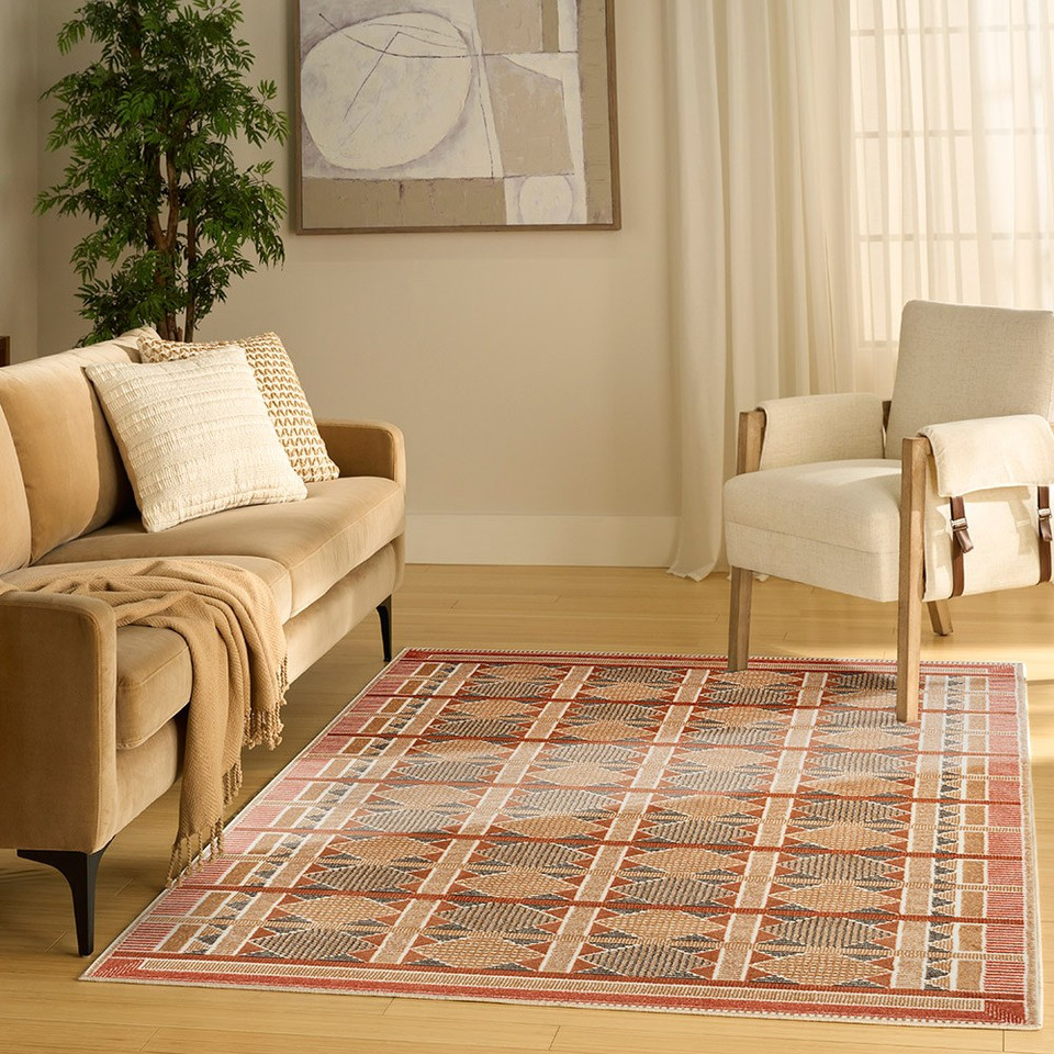 rust blue geometric rug in a living room