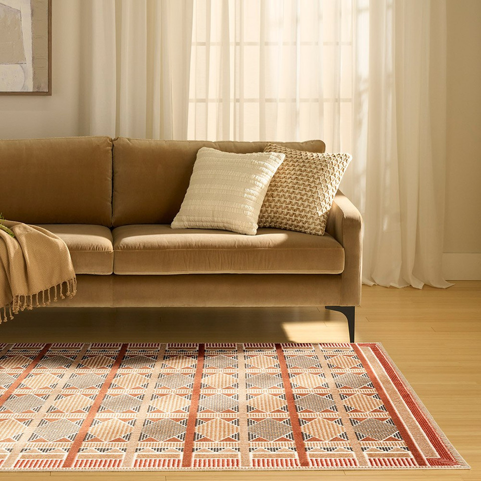 rust blue geometric rug in a living room