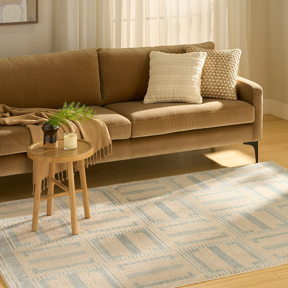 ivory blue geometric rug in a living room