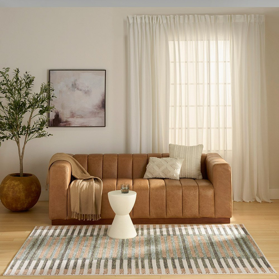 ivory multi geometric rug in a living room