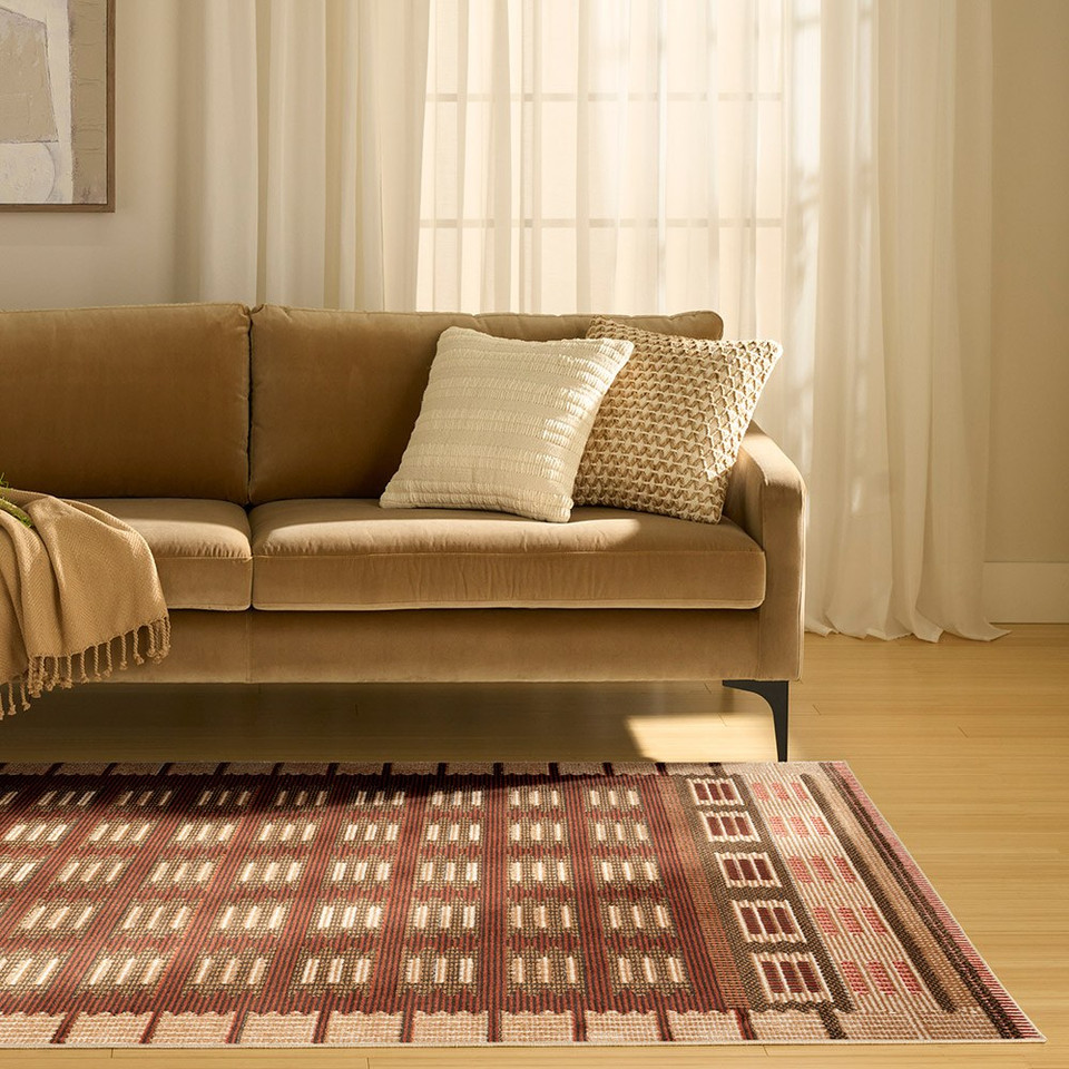 rust geometric rug in a living room