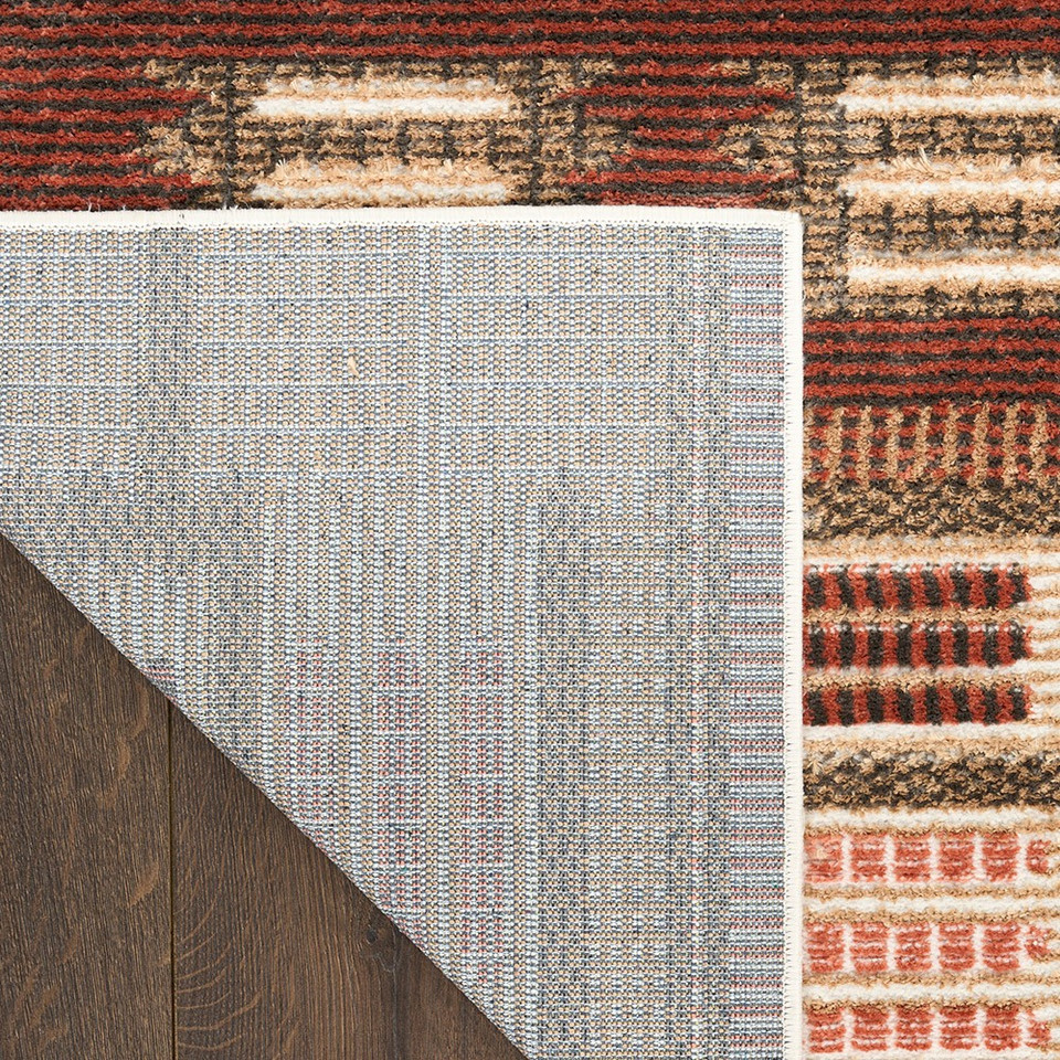 rust geometric rug corner fold