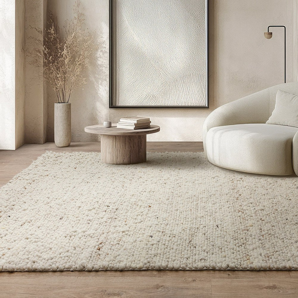 ivory wool rug in living room with matching decor