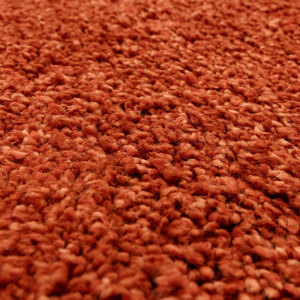 orange shaggy rug closeup detail