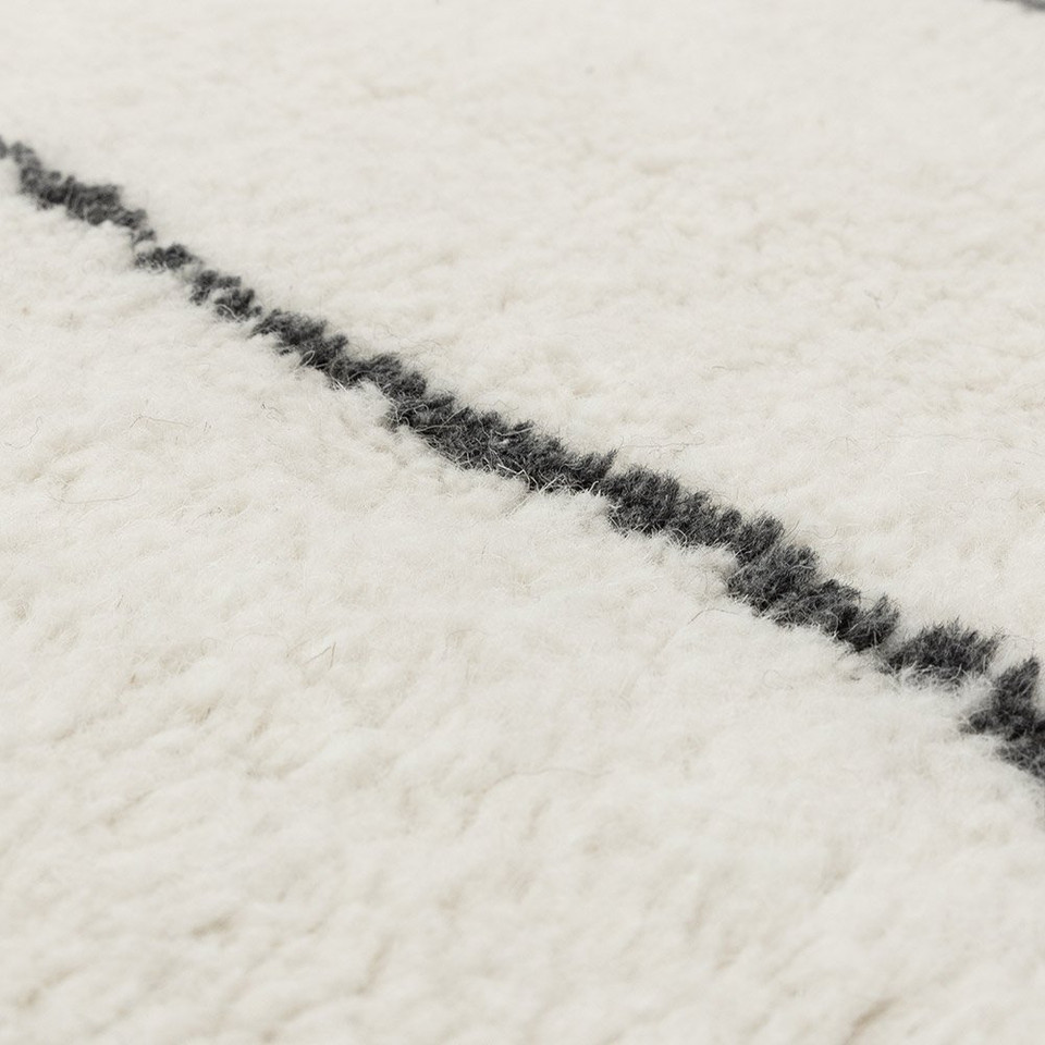 cream berber shaggy wool rug closeup detail