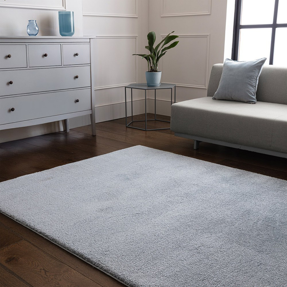 blue plain shaggy rug in a living room with matching decor