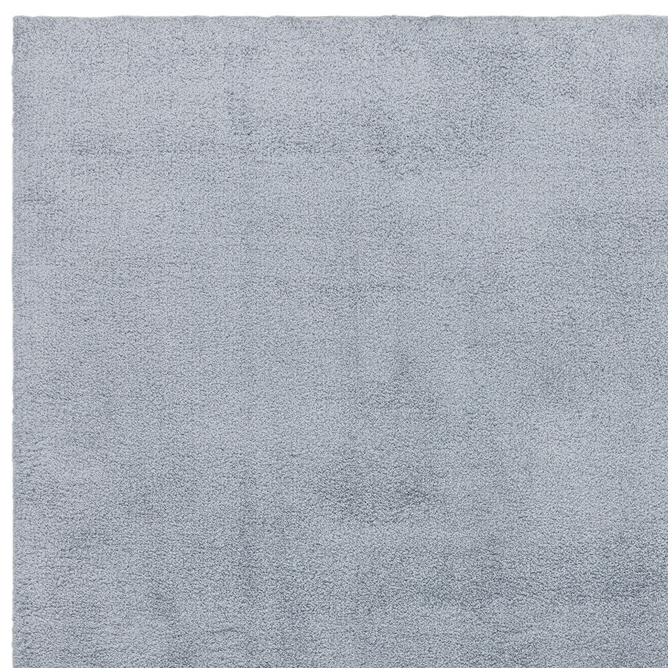 blue plain shaggy rug portrait corner