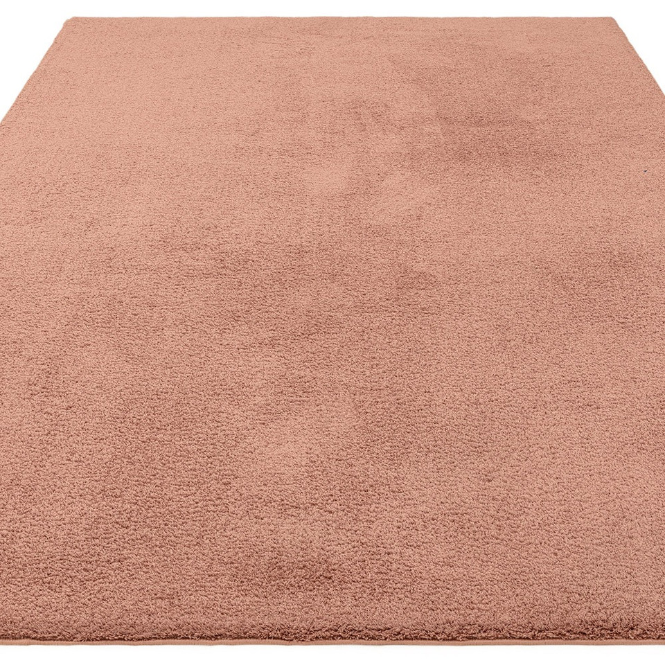 pink plain shaggy rug portrait angle