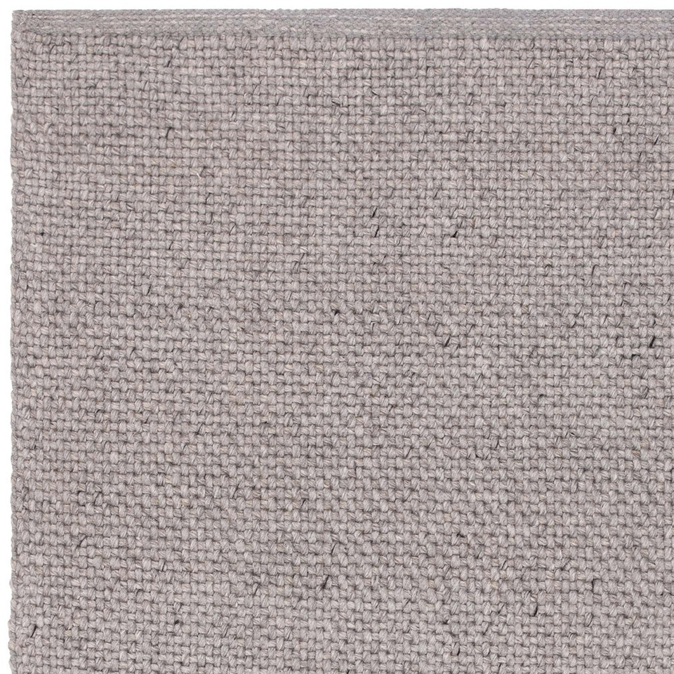 grey plain flatweave rug portrait corner
