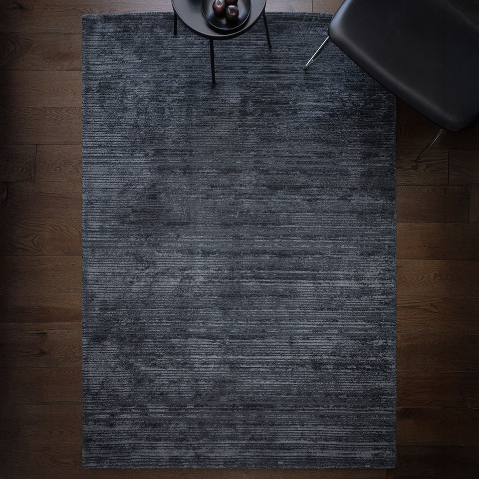 petrol plain viscose rug in a living room with matching decor
