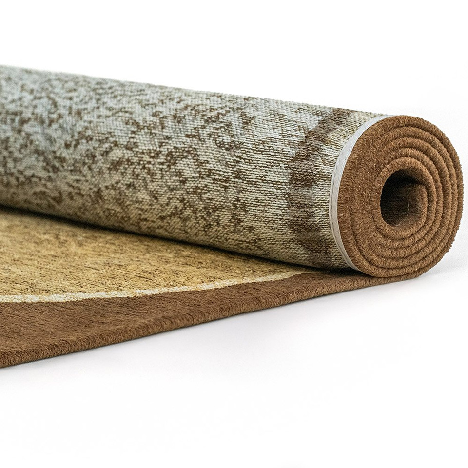 beige abstract eco rug partially rolled on a white floor