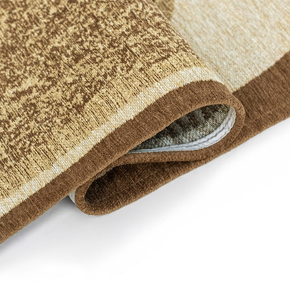 beige abstract eco rug folded on white floor