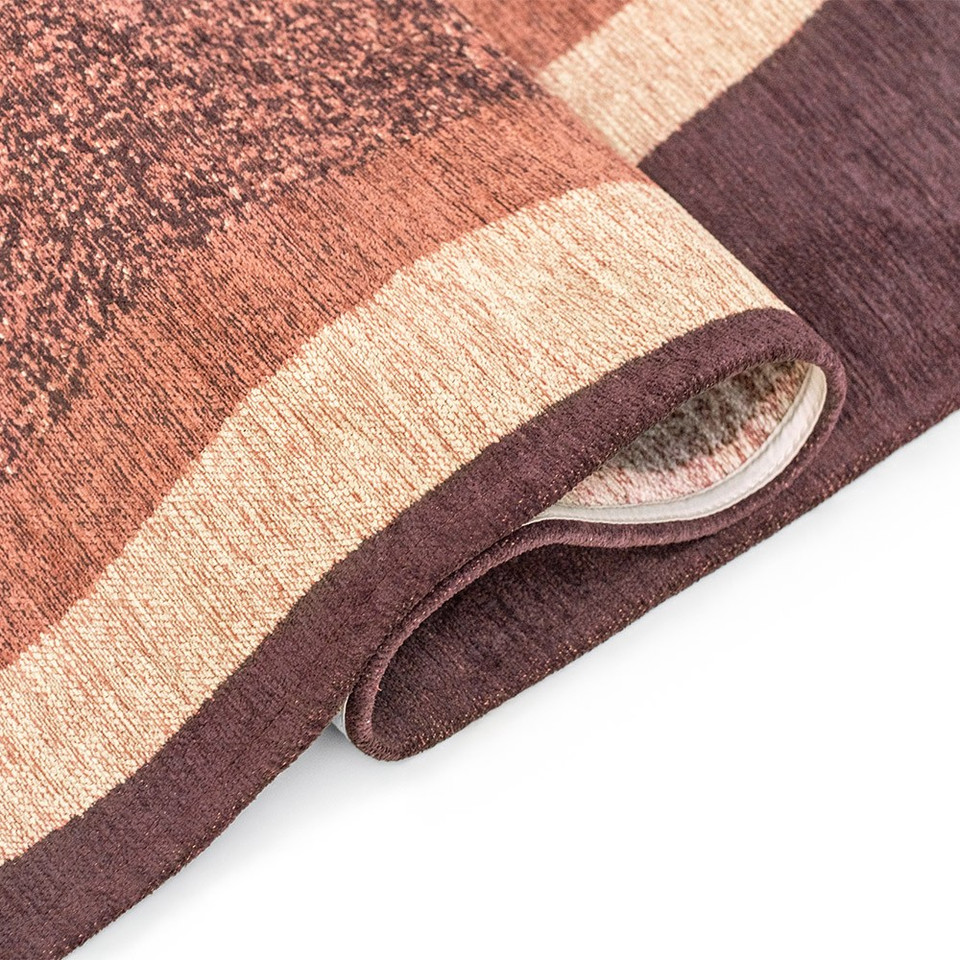 purple abstract eco rug folded on white floor