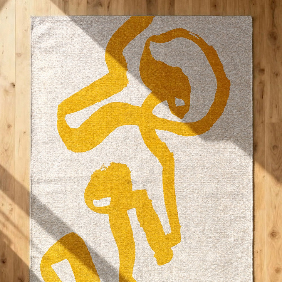 yellow cream eco rug above shot on wood floor