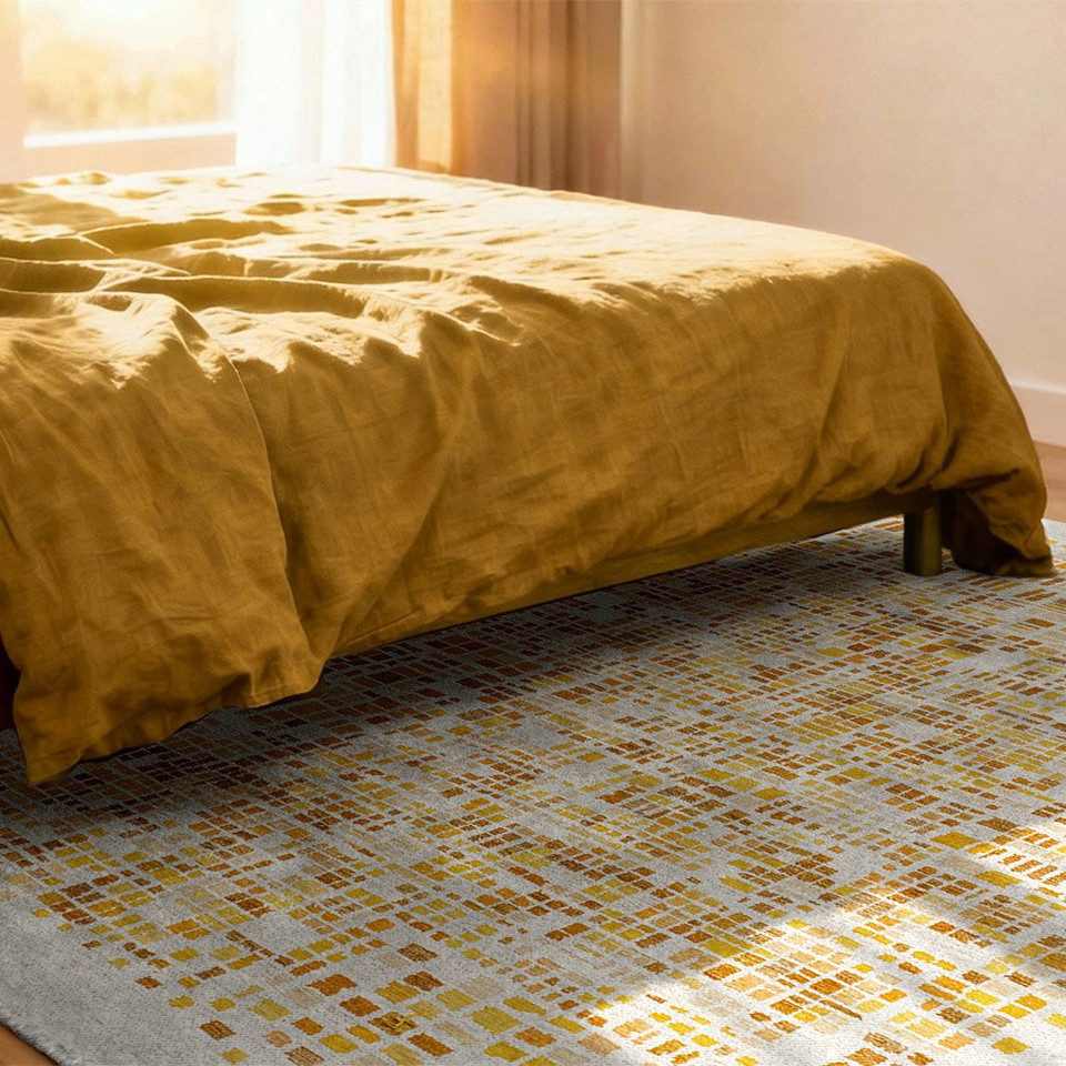 yellow abstract rug in a bedroom with matching decor