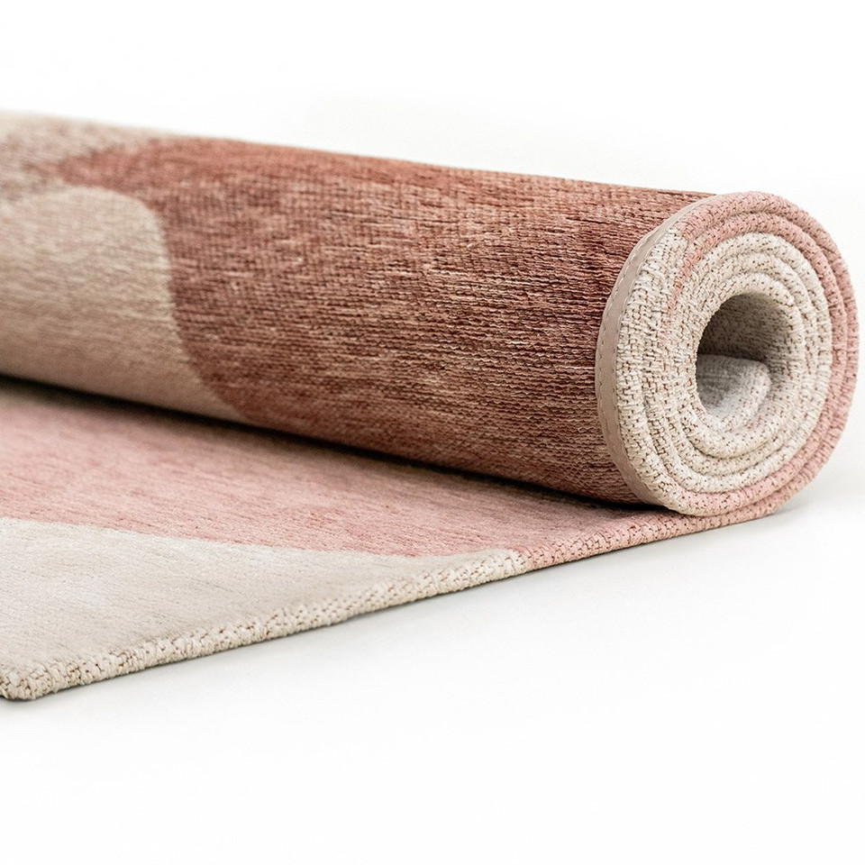 cherry mocha abstract rug rolled on white floor