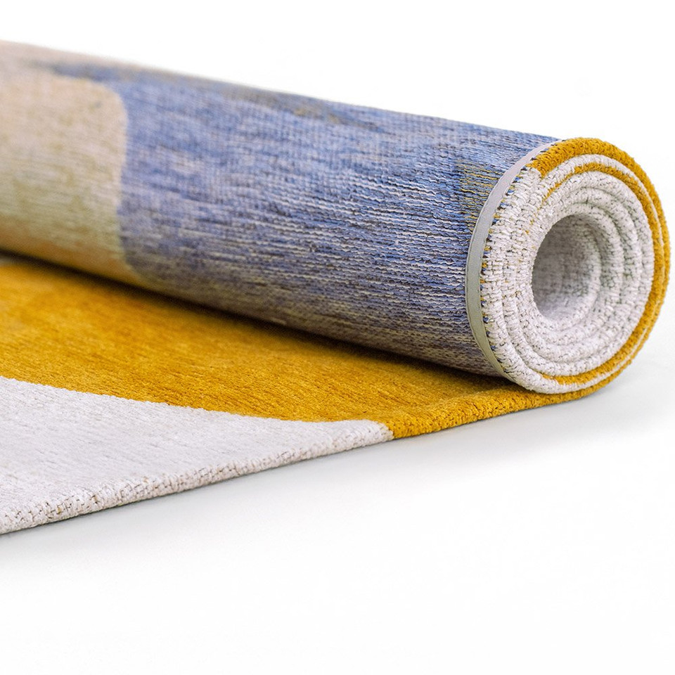 multicolour abstract rug rolled on white floor