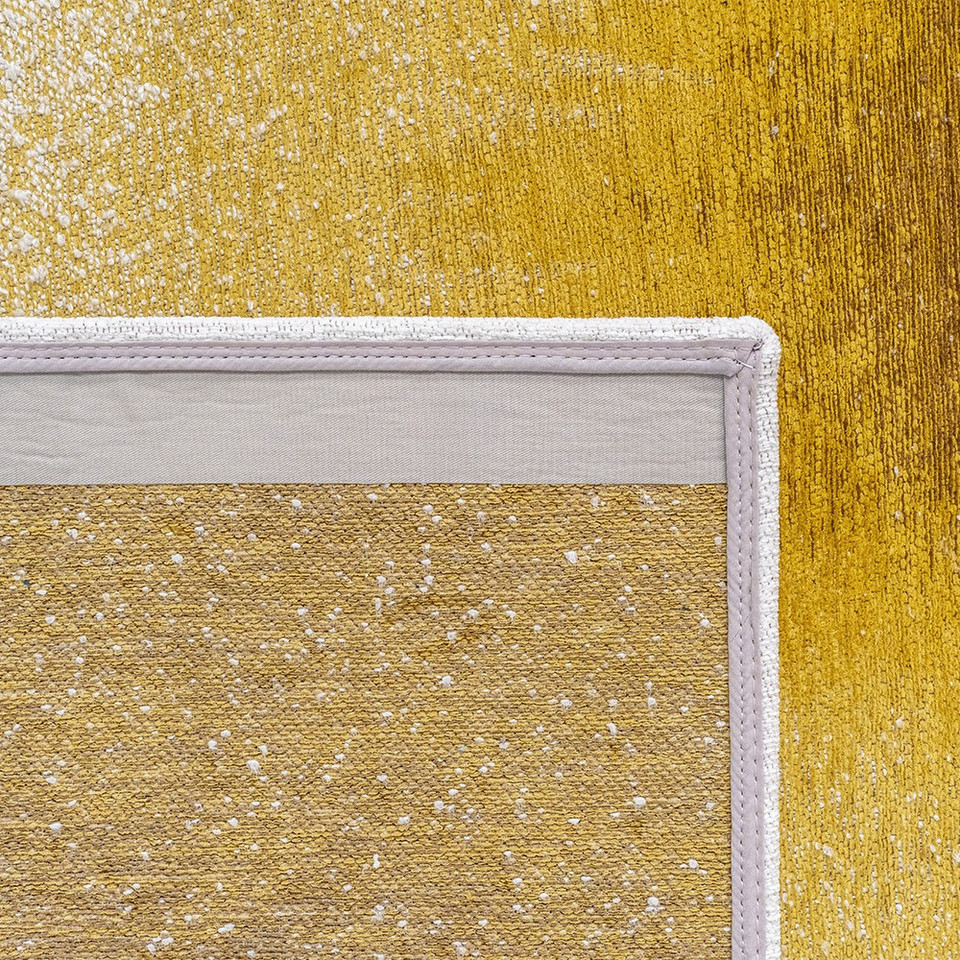 gold abstract rug closeup corner fold