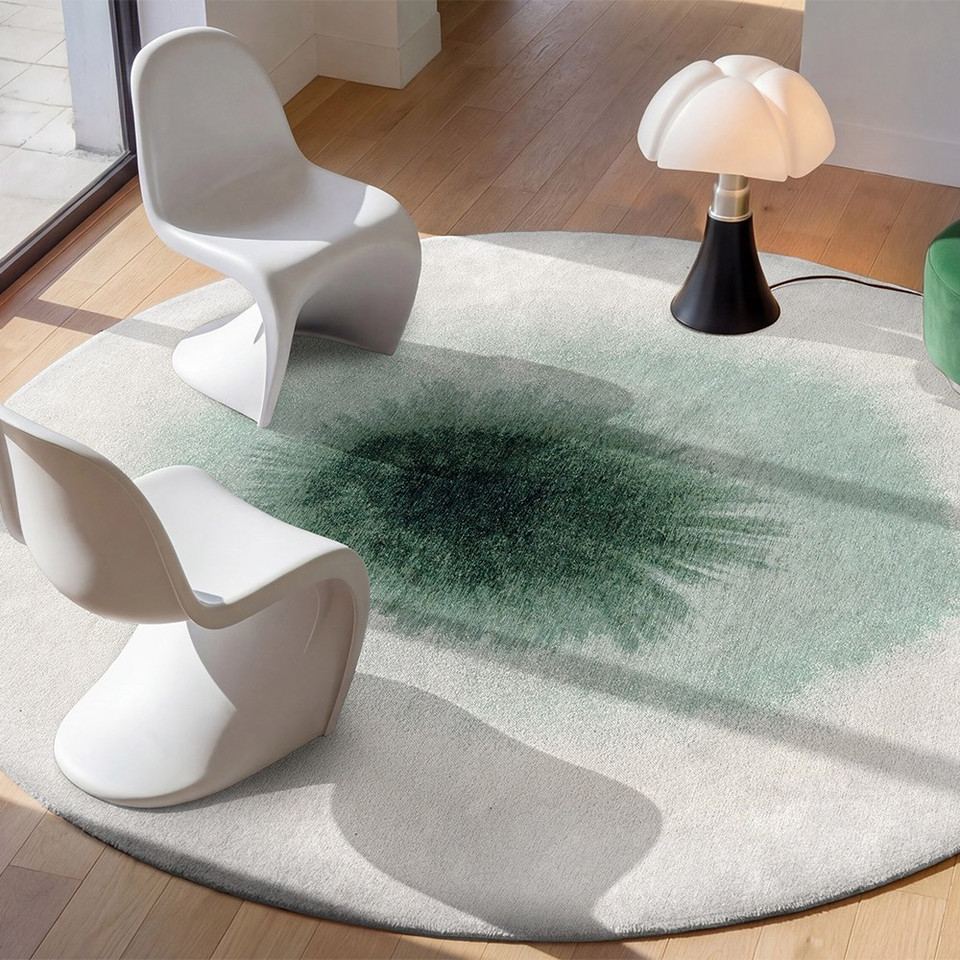 green abstract rug in a living room with matching decor