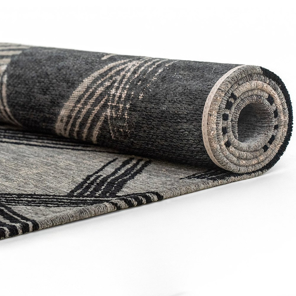 grey  rug rolled on white floor