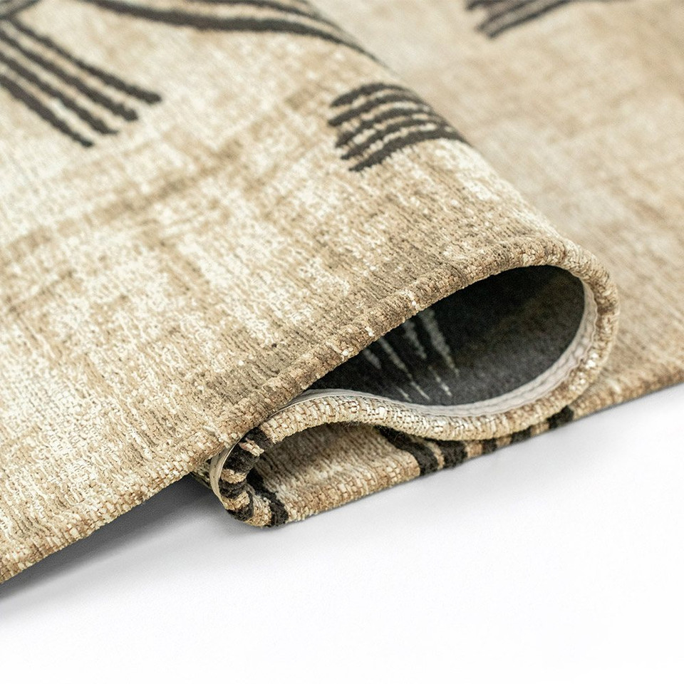 slate abstract rug folded on white floor