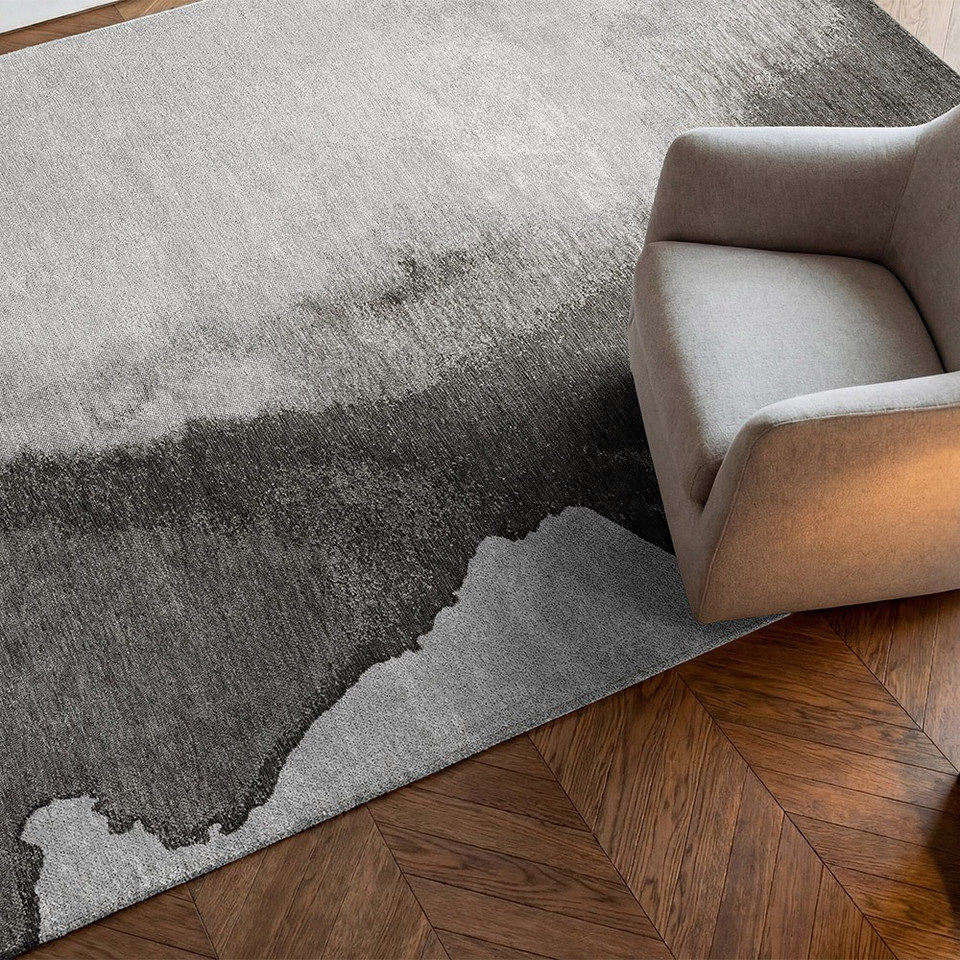 black abstract eco rug in a living room with matching decor