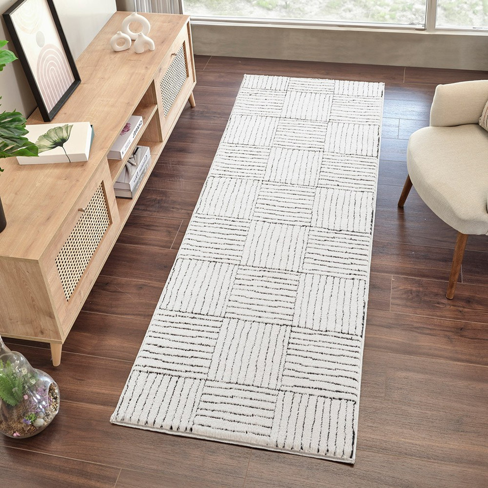 ivory black scandi rug runner in a room with matching decor