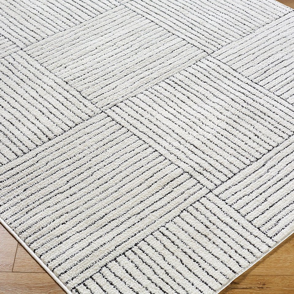 ivory black scandi rug closeup corner on wood floor