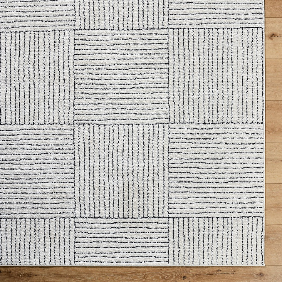 ivory black scandi rug closeup corner on wood floor