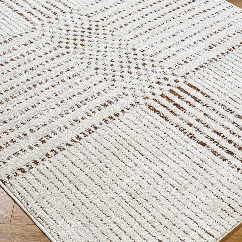 brown ivory scandi rug closeup corner on wood floor