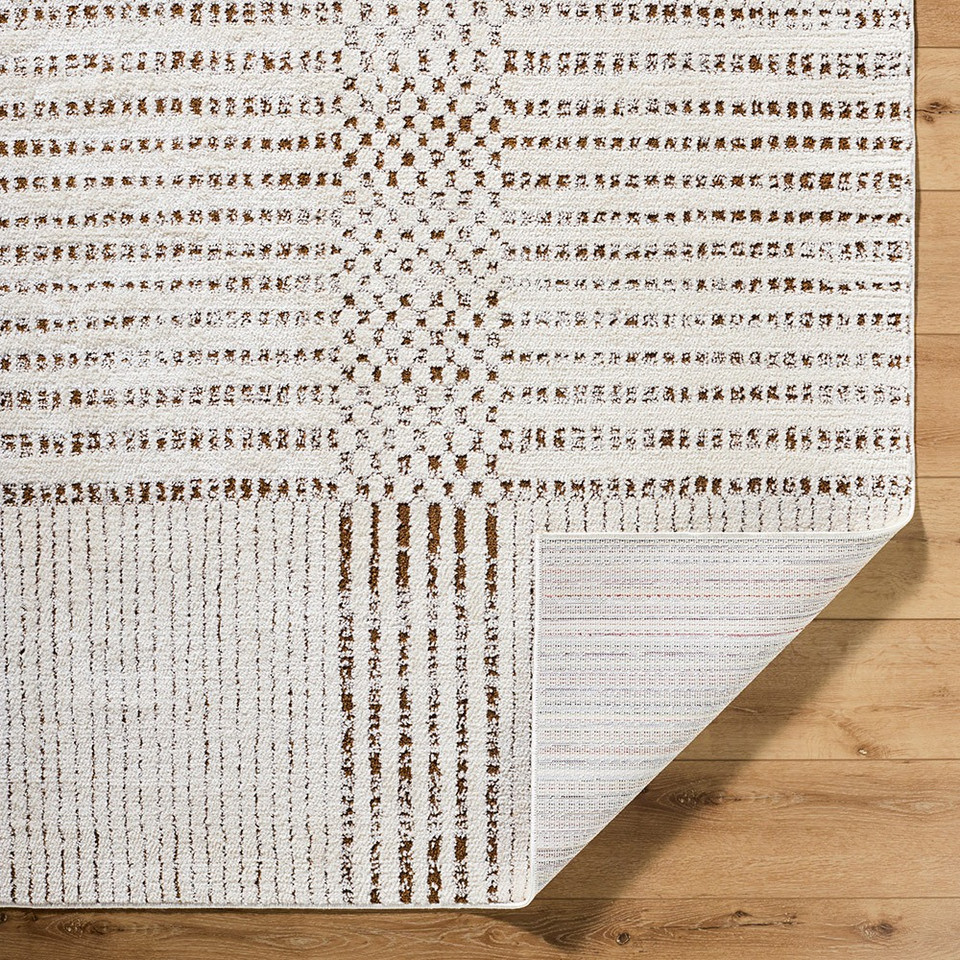 brown ivory scandi rug corner fold on wood floor