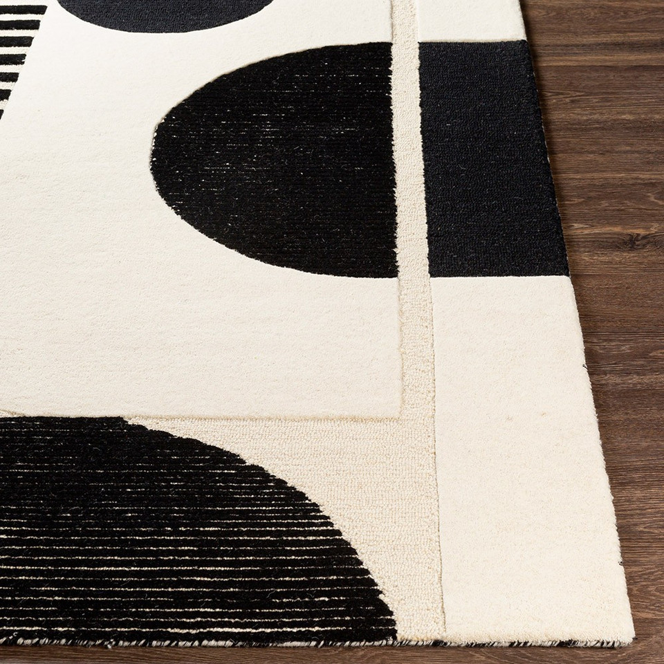 cream geo wool rug closeup corner on wood floor