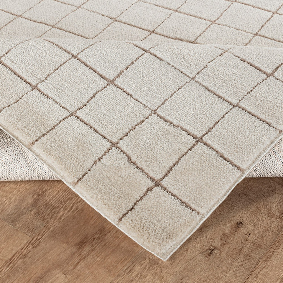 taupe ivory scandi rug corner fold on wood floor