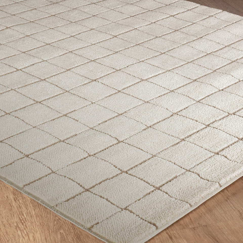 taupe ivory scandi rug closeup corner on wood floor